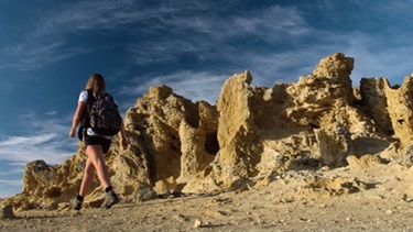 Woman hiking near cliffs