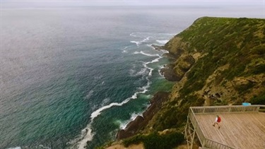 A lookout point with ocean and cliff views