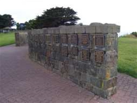 A sandstone wall with plaques