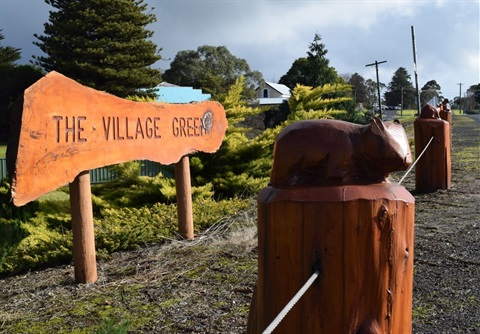 The Village Green Signage and tree carvings